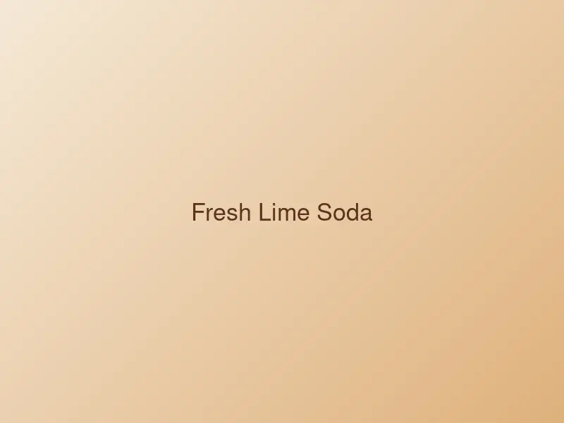 Glass of fresh lime soda with ice and mint