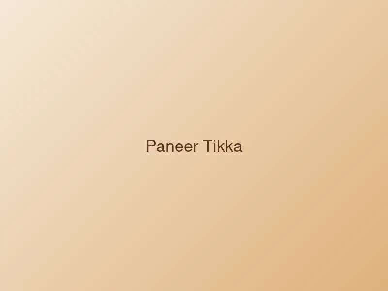 Skewers of grilled paneer tikka with charred peppers and onions