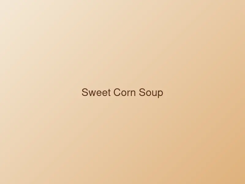 Bowl of creamy sweet corn soup with vegetables