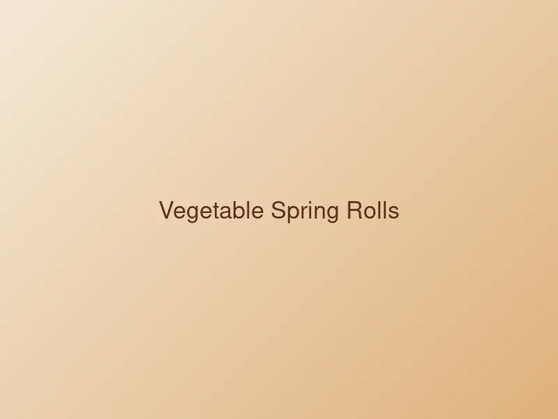 Golden vegetable spring rolls served with a dipping sauce